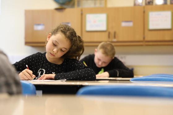 Child drawing with crayon